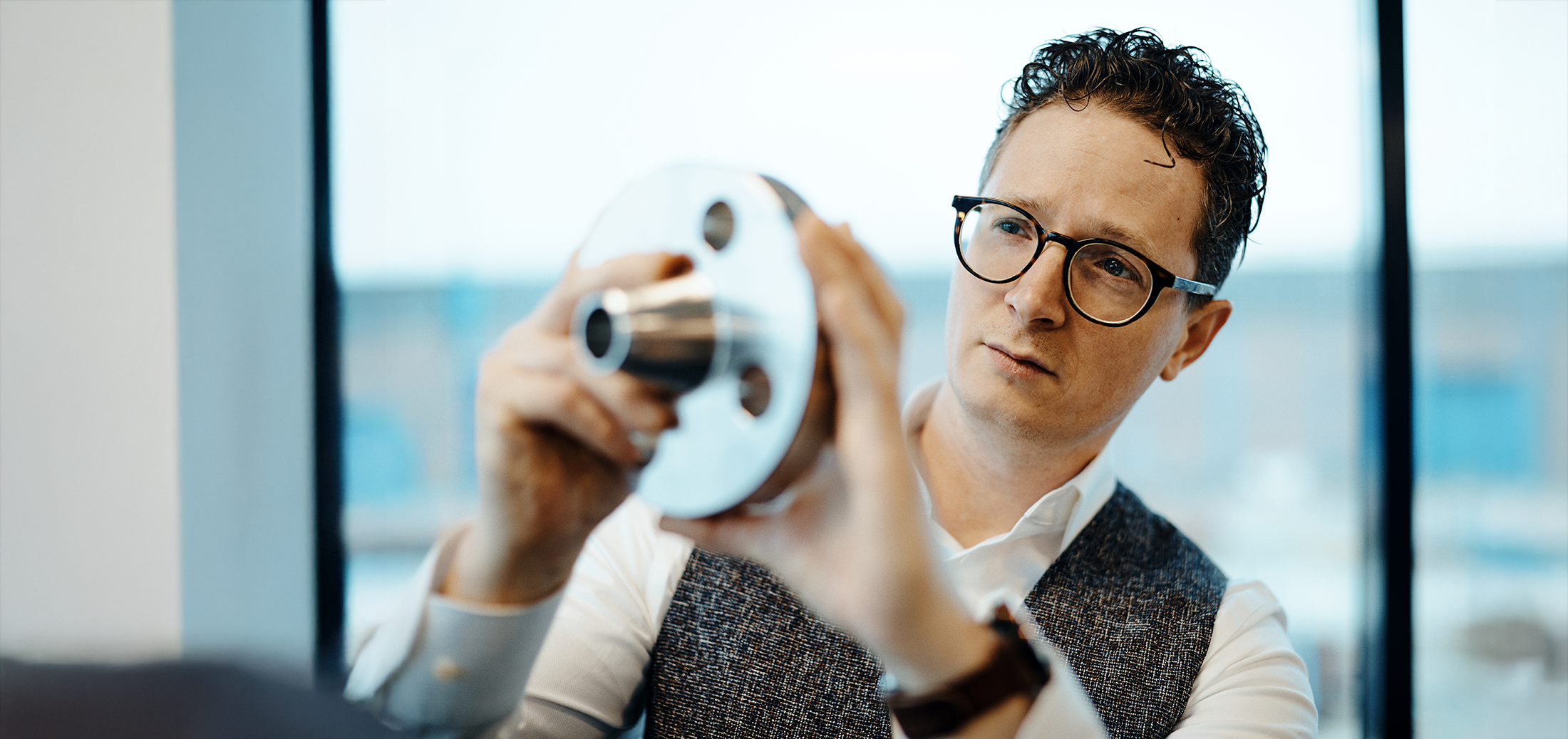 Expert Inspecting Steel Flange for Quality and Precision